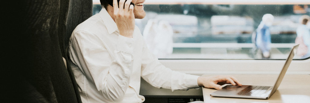 Man working during a train journey